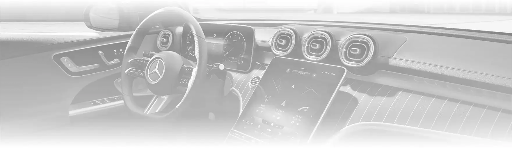 C-Class dashboard and portrait touchscreen seen from the driver's side.