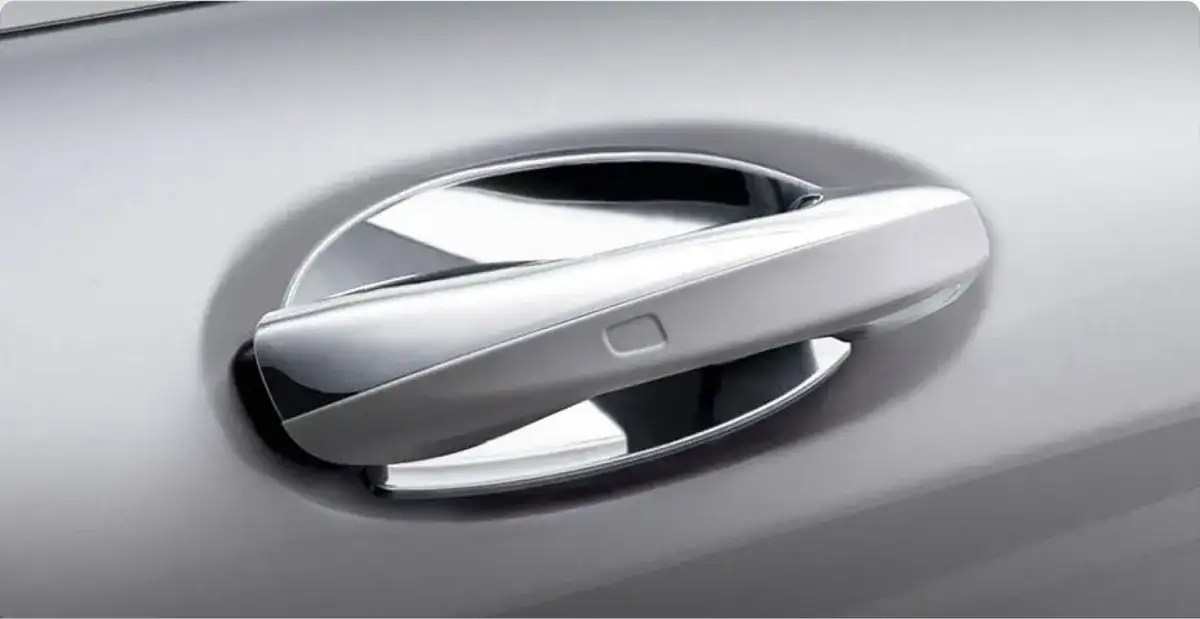 Chrome insert set into the door handle recess of a silver GLA.