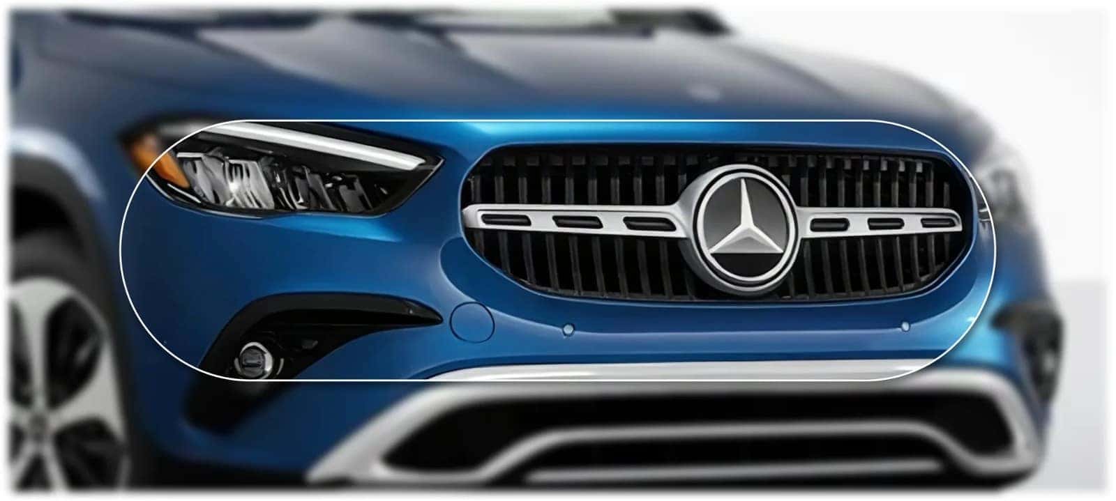 Front end of a blue GLA 250 4MATIC SUV showing the grille, Star and LED headlamp.