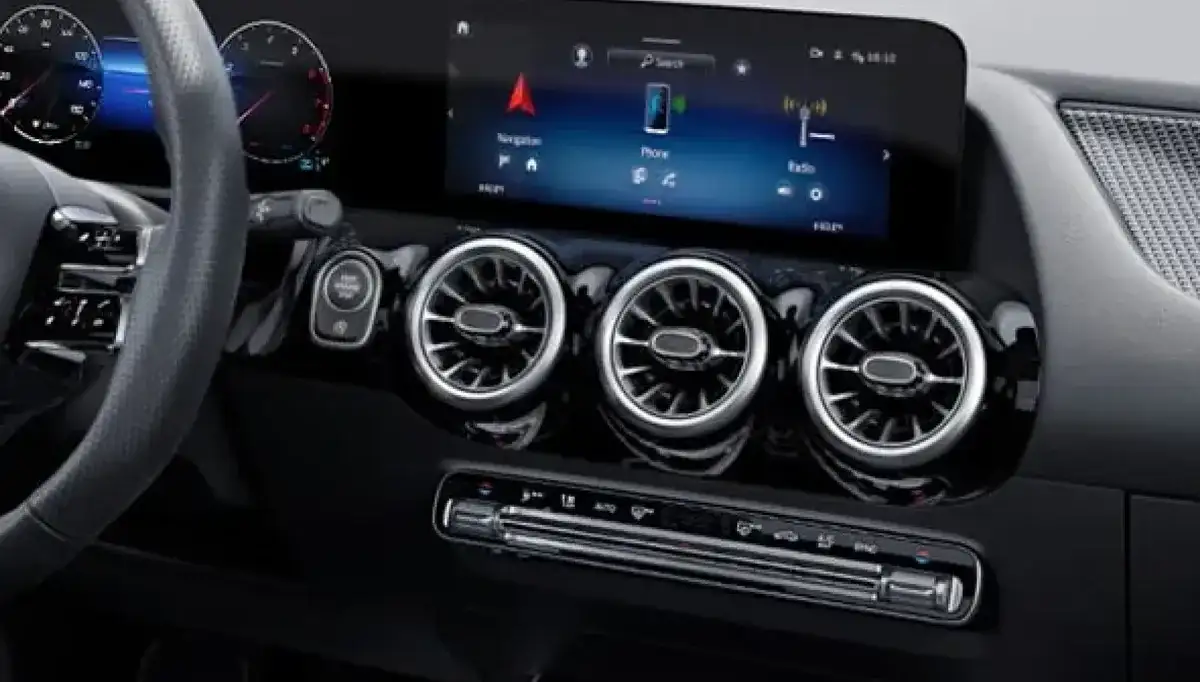 Central touchscreen showing the MBUX home screen.