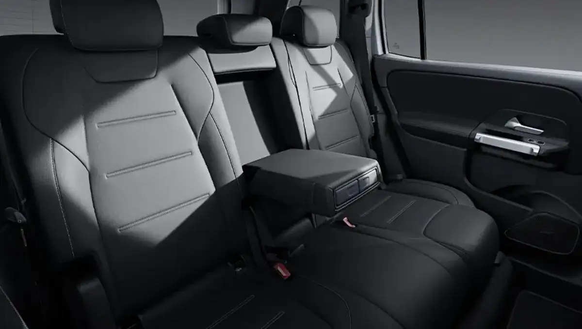 Second-row centre armrest folded down with two built-in cupholders.
