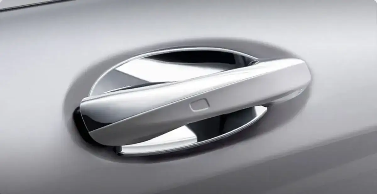 Chrome insert set into the door handle recess of a silver GLB.