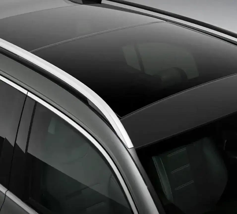 Chrome window surround and roof rail along the side of a black GLB.