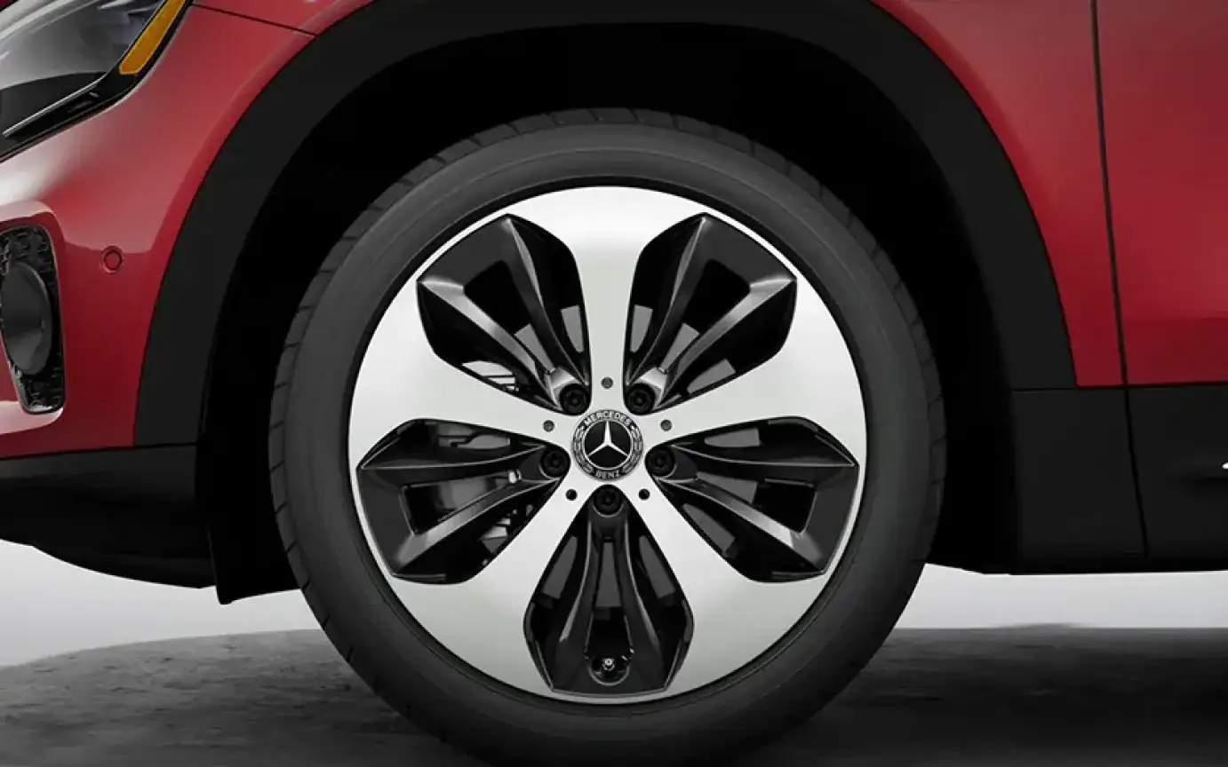 Twin 5-spoke wheel and black wheel-arch trim on a red GLB.