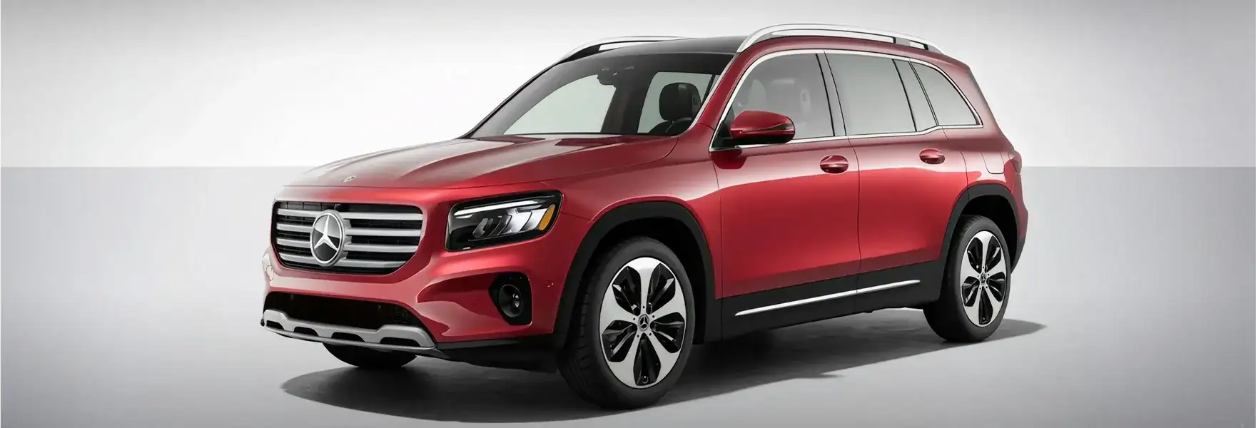 White GLB 250 4MATIC SUV shown from a front three-quarter angle on a pale grey backdrop.