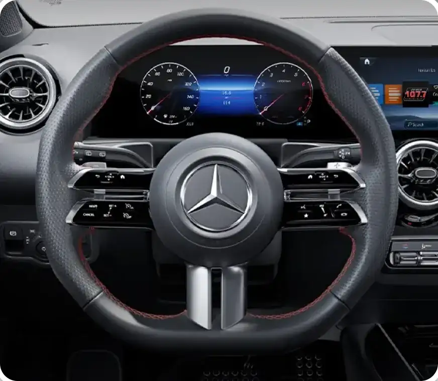 GLB multifunction steering wheel in front of the widescreen instrument display.