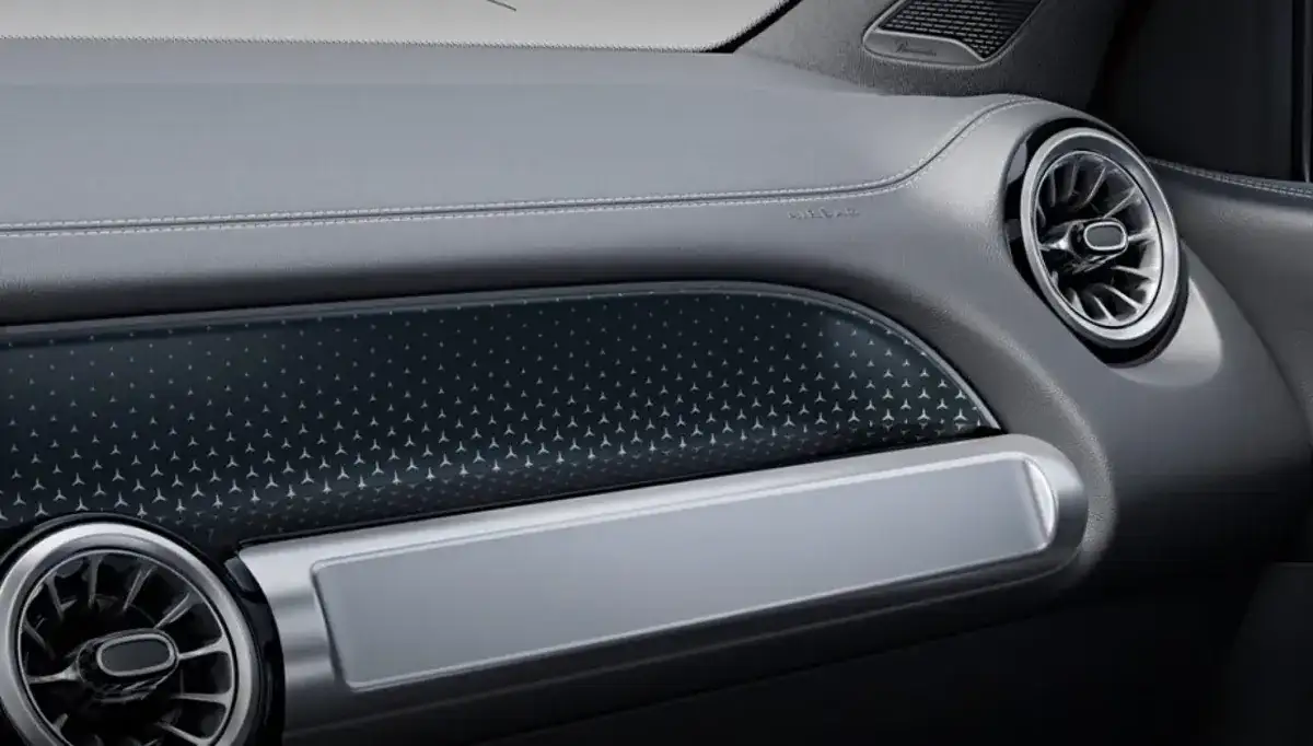 Dashboard inlay patterned with tiny silver Three-Pointed Stars beside a turbine air vent.