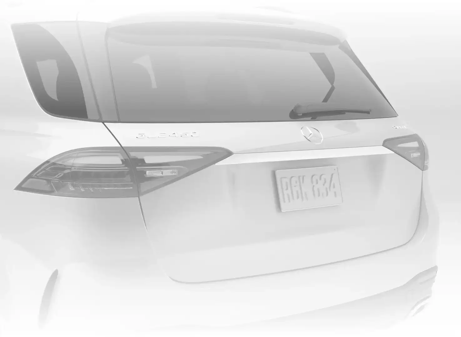 White GLE 450 4MATIC SUV seen from a rear three-quarter angle.