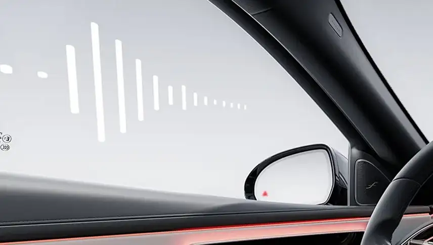 Side mirror of the E-Class showing the illuminated red Blind Spot Assist warning icon.