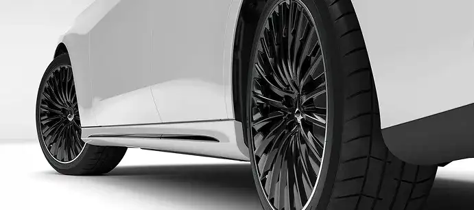 Side profile of a white E 350 4MATIC Sedan on black multi-spoke wheels.