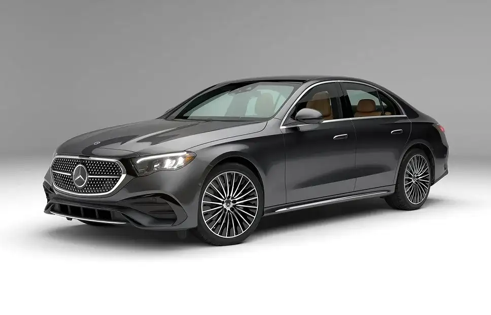 Front three-quarter view of a grey E 350 4MATIC Sedan in a studio setting.
