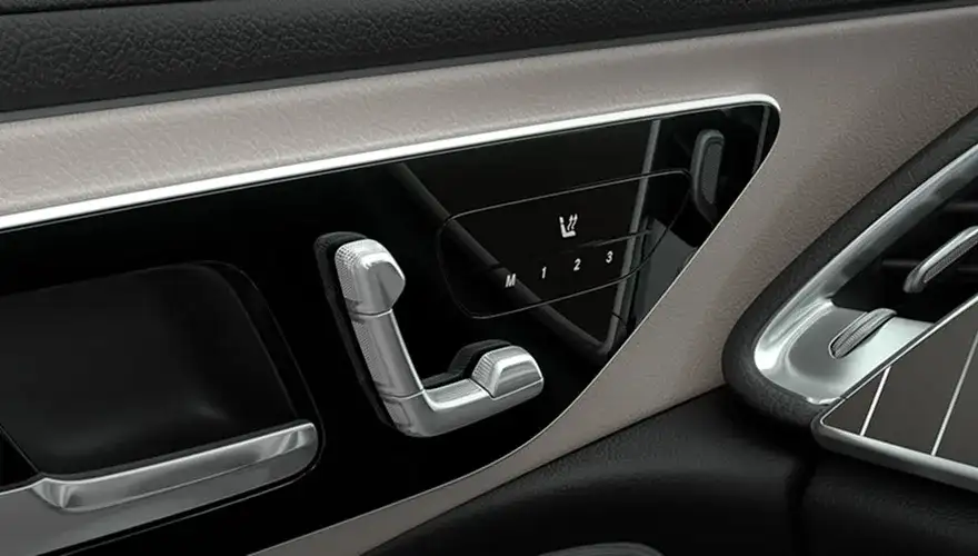 Seat-shaped power seat controls on the door panel of the E 350 4MATIC Sedan.