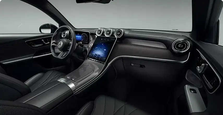 GLC cockpit at night showing the digital instrument cluster and portrait central touchscreen.