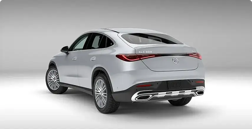 White GLC 300 4MATIC Coupe shown from a rear three-quarter angle on a white studio backdrop.