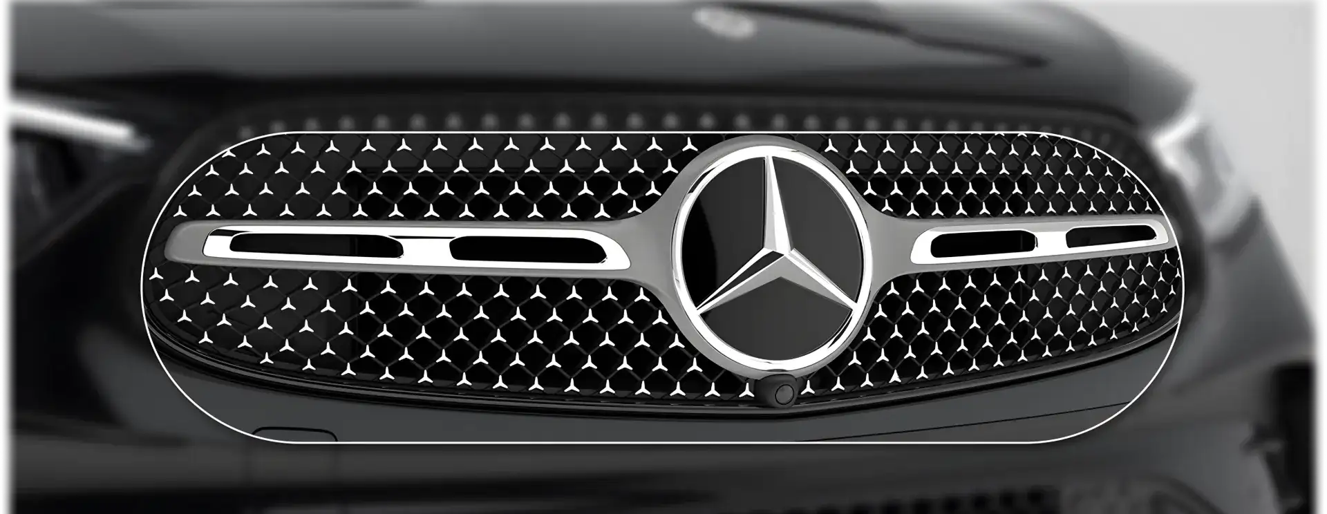 Close view of the chrome Star-pattern grille on the GLC 300 4MATIC Coupe.