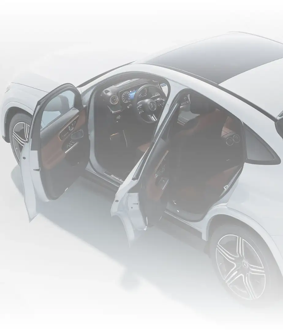 White GLC 300 4MATIC Coupe with every door and the tailgate open, showing the interior.