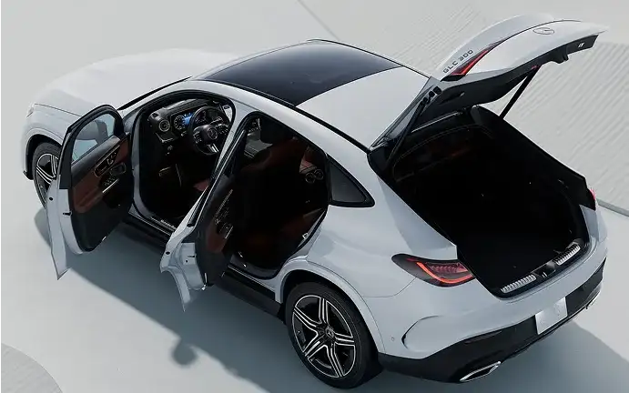 White GLC 300 4MATIC Coupe with every door and the tailgate open, showing the interior.