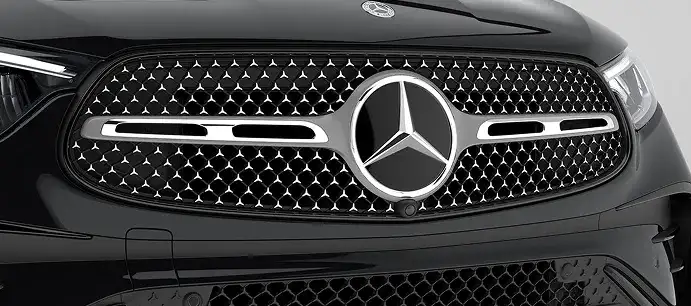 Close view of the black Star-pattern grille and Three-Pointed Star on the GLC Coupe.
