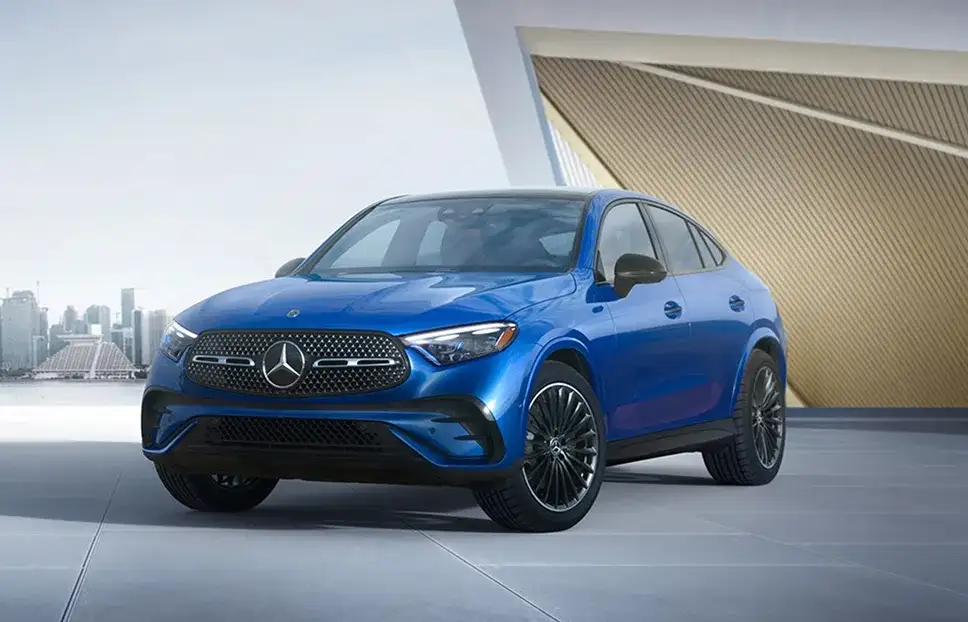 Blue GLC 300 4MATIC Coupe photographed against a city skyline.
