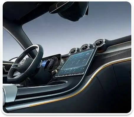 GLC cabin with backlit trim and the driver display glowing at dusk.