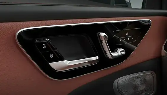 Seat-shaped power seat controls and memory buttons on the GLC door panel.