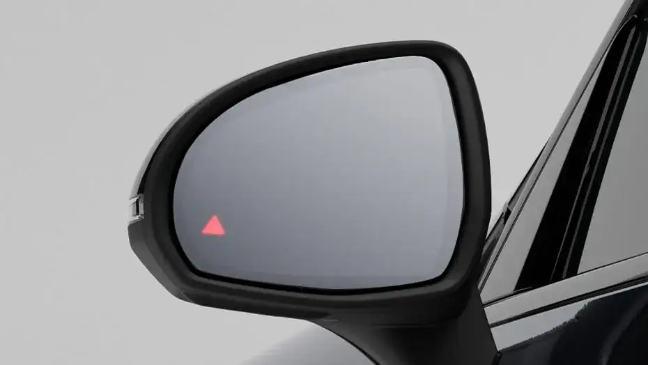 GLC side mirror showing the illuminated red Blind Spot Assist warning icon.