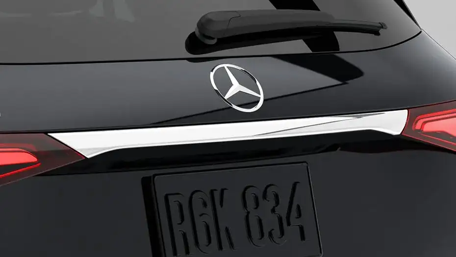 Polished chrome strip fitted across the liftgate of a black GLC above the licence plate.