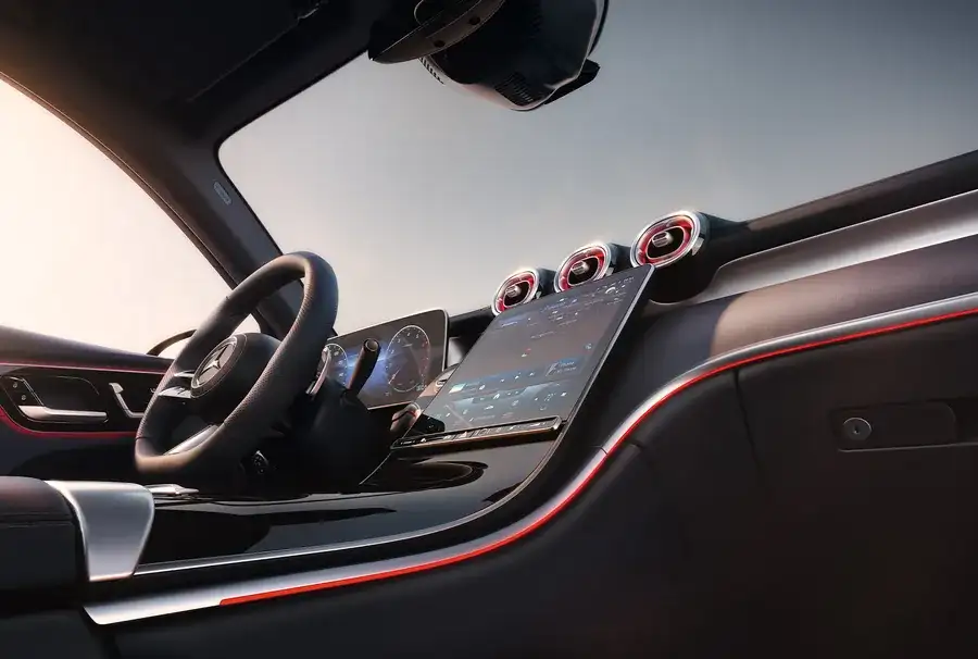 GLC 300 cabin at night with red ambient lighting tracing the dash and door trim.