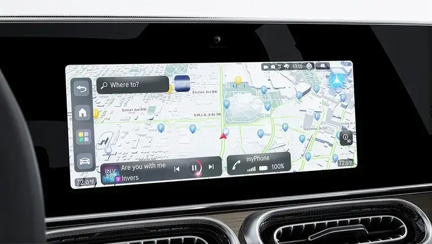 Central touchscreen displaying the MBUX Navigation map with a destination search bar.