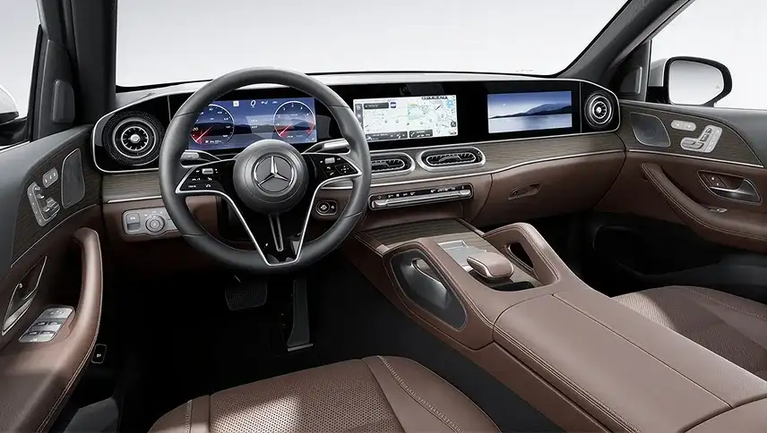 GLE cabin in brown leather showing the cross-cabin displays and centre console.