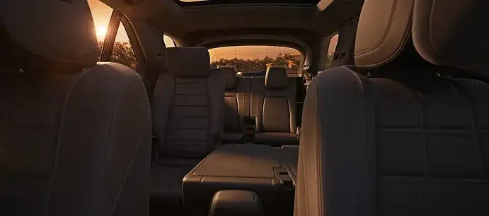 GLE rear cabin at sunset with the second-row seats folded down.