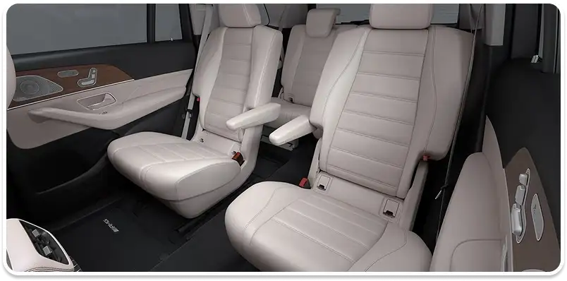Beige leather second- and third-row seats seen through the open side of the cabin