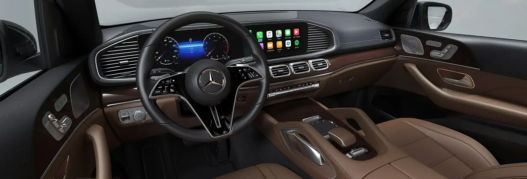 GLS cockpit with the steering wheel, widescreen displays and brown leather trim