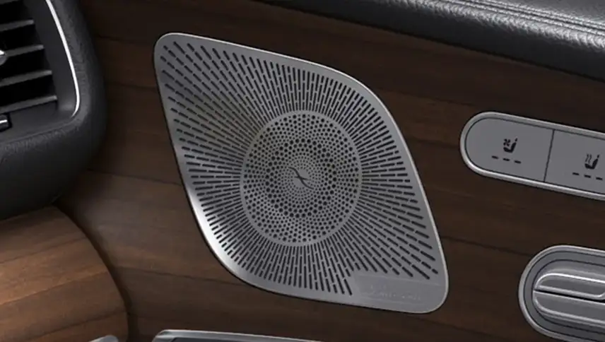 Perforated Burmester speaker grille set into the GLS wood dashboard trim