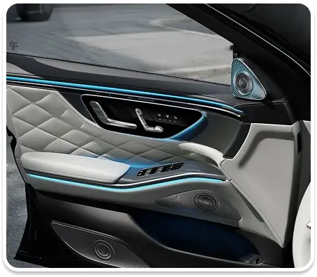 Door panel with white quilted leather and blue ambient lighting