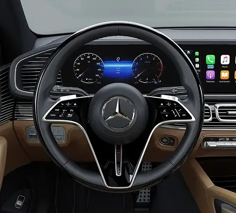 GLS steering wheel, instrument cluster and dashboard in a tan-trimmed cabin