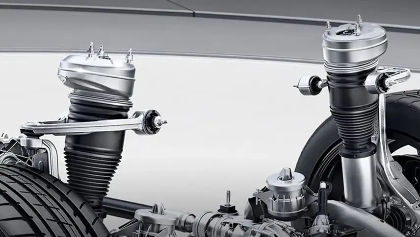 Cutaway front suspension showing the AIRMATIC air spring and damper units