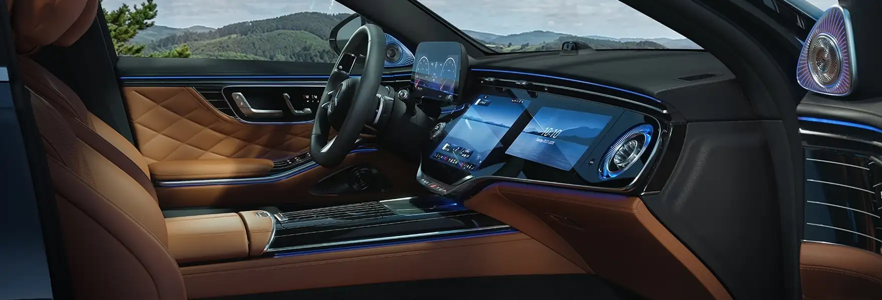 S-Class cockpit in saddle brown leather with a mountain view through the windshield