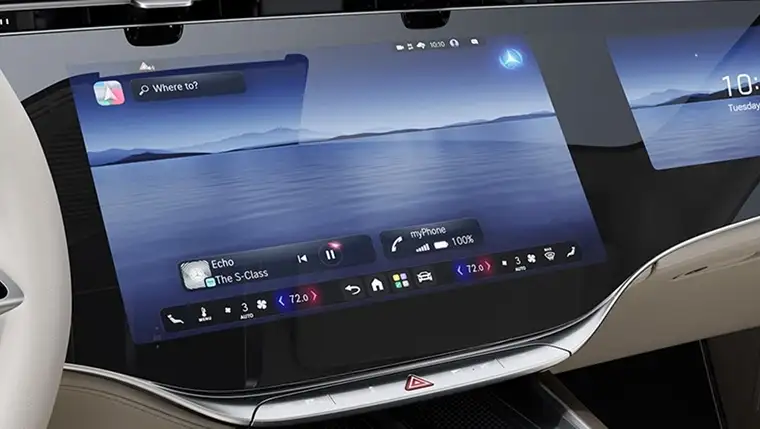 Close-up of the 14.4-inch central touchscreen showing the media and climate home screen