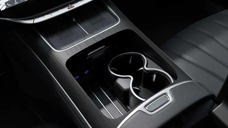 Center console with twin cupholders and the dual wireless charging tray