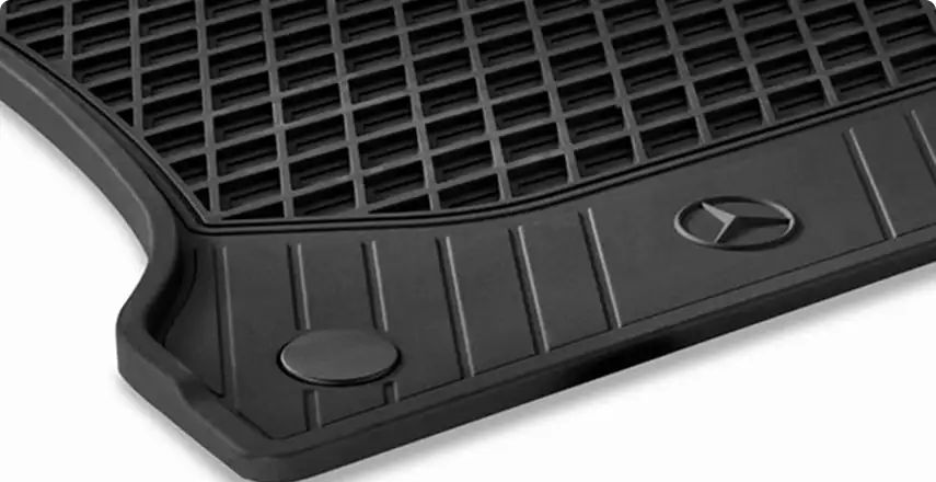 Black rubber all-season floor mat embossed with the Mercedes-Benz star