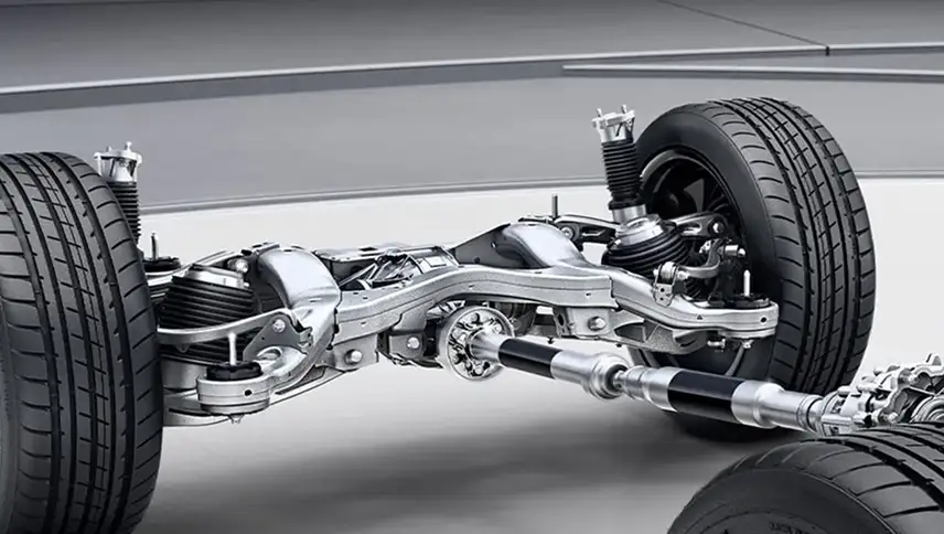 Bare all-wheel-drive chassis with four wheels, driveshafts and both axles exposed