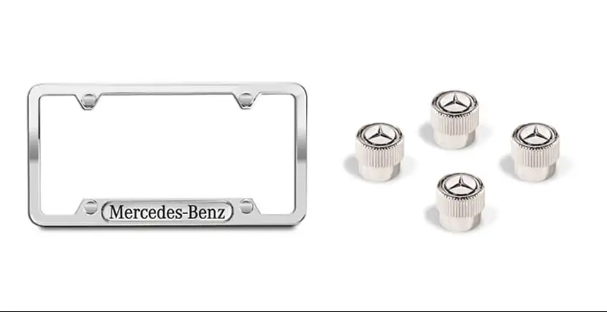 Chrome Mercedes-Benz license plate frame beside four star-topped valve stem caps