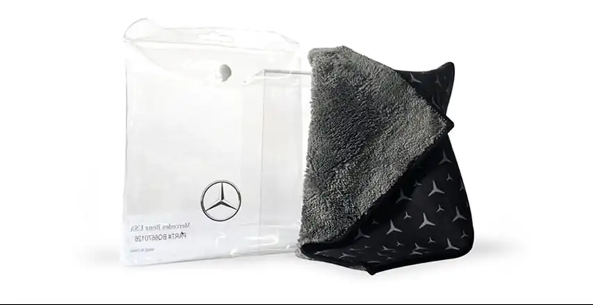 Gray microfiber cleaning cloth with a star-patterned side in a clear storage pouch