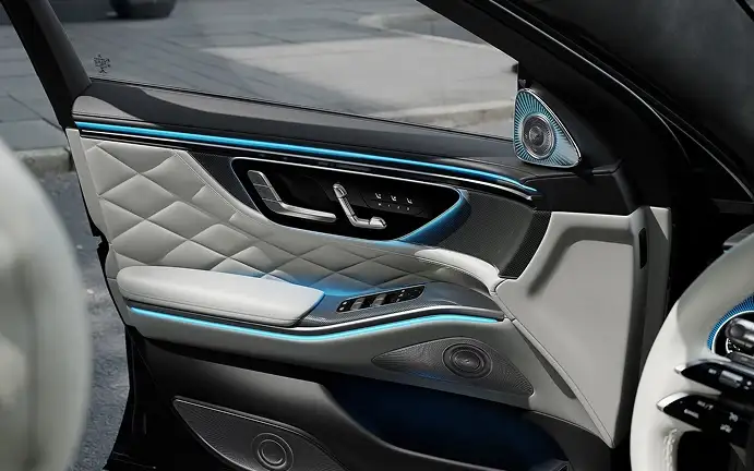 S-Class door panel lit by blue ambient lighting at night