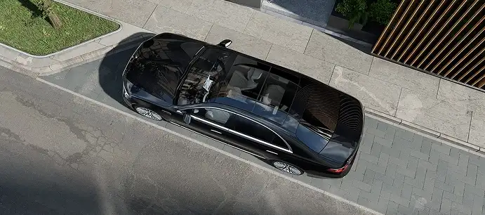 Overhead view of a black S-Class showing its panoramic roof