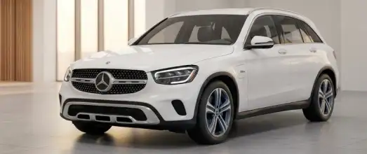 White Mercedes-Benz GLC hybrid SUV in a showroom