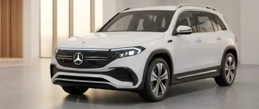 White Mercedes-Benz EQB electric SUV in a showroom