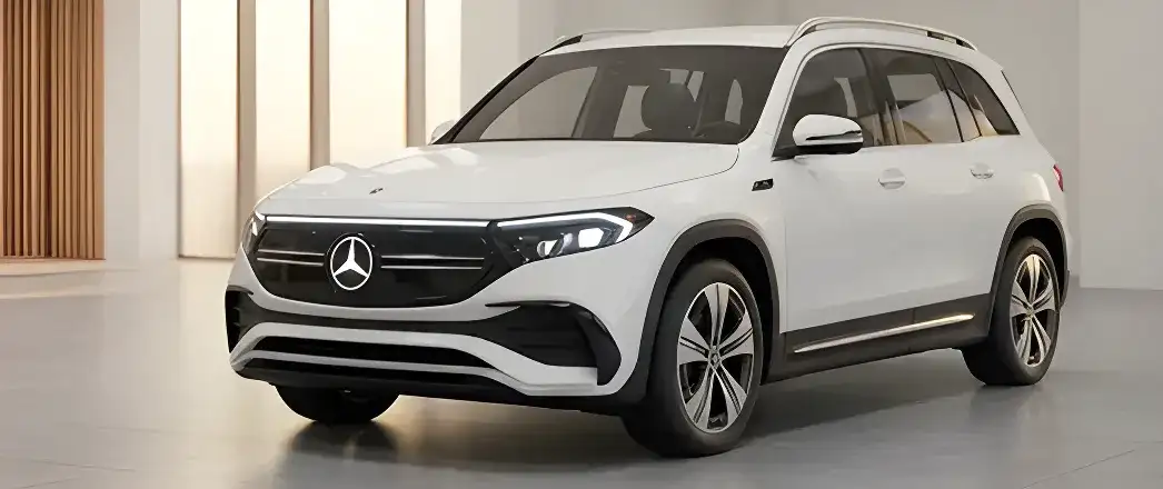 White Mercedes-Benz all-electric SUV in a light-filled showroom.