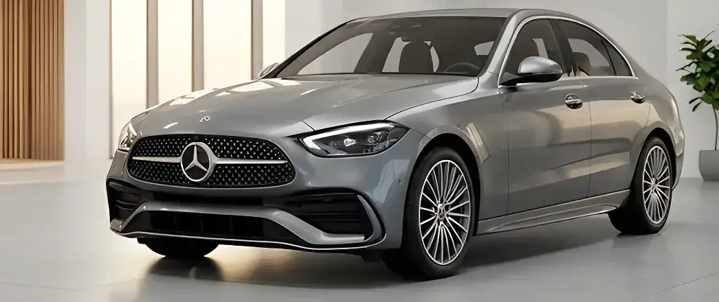Silver Mercedes-Benz sedan in a light-filled showroom.